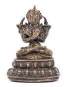 A gilt copper alloy figure of Vajradhara, Tibet,  16th-17th century, seated in vajrasana on a