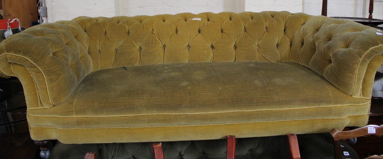 An Edwardian swept arm sofa