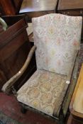 A 19th Century oak Continental armchair with velvet upholstery