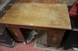 A Sheraton Revival style kneehole desk with floral marquetry.