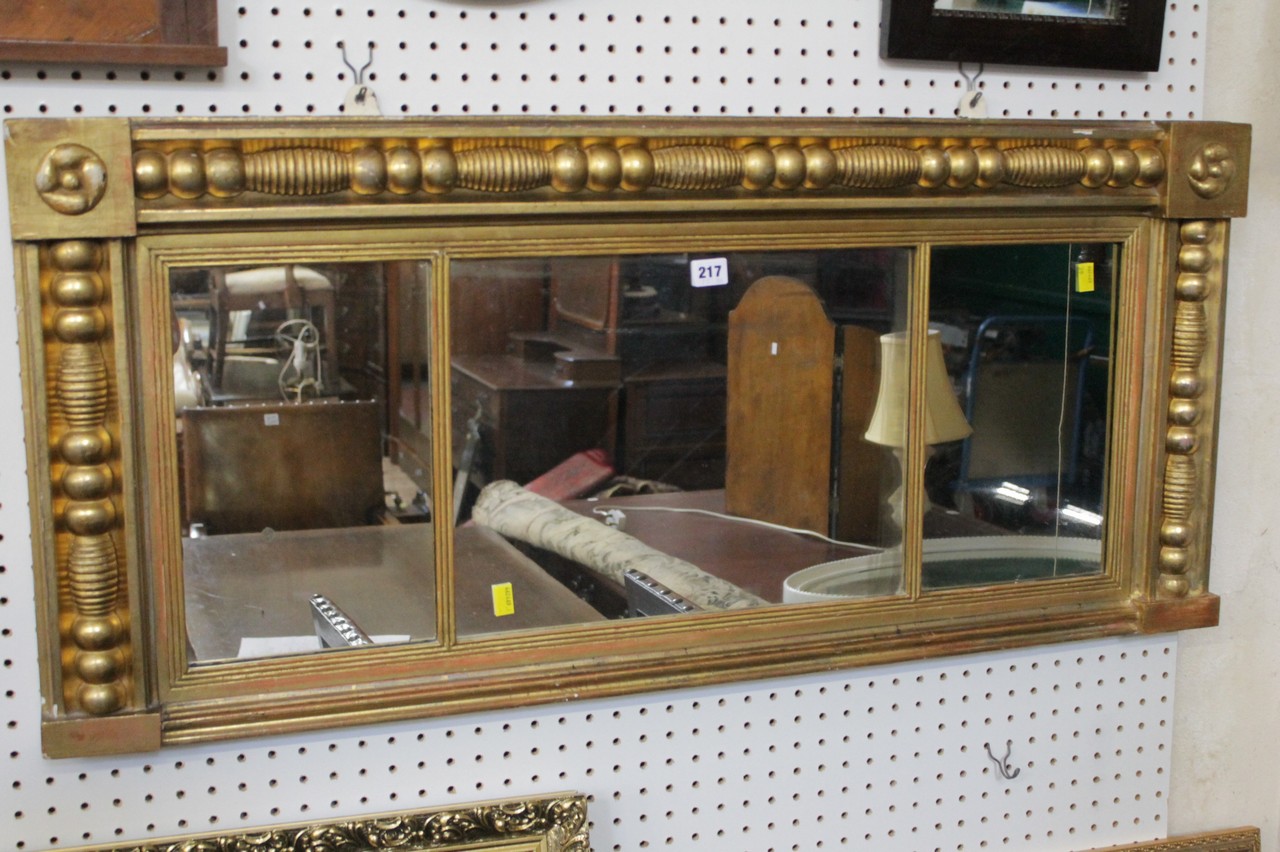 A Regency triple mirror, gilt frame 50cm high, 110cm wide