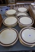 A Royal Worcester part dinner service, bearing a crest, approximately 47 pieces (some a/f)