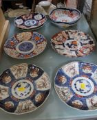 A pair of Oriental Imari pallete scalloped rimmed dishes, together with five further similar items