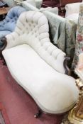 A Victorian mahogany chaise longue and a Victorian button back armchair