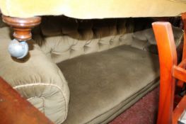 A Victorian green upholstered chesterfield sofa