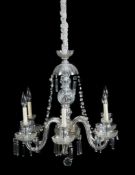 A Continental moulded glass six light chandelier, 20th century, the scrolling branches around a