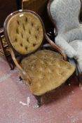 A Victorian rosewood framed armchair, a Victorian spoonback chair and an Edwardian nursing chair.
