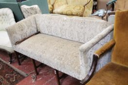 An Edwardian square back settee raised on square tapering legs, 170cm wide.