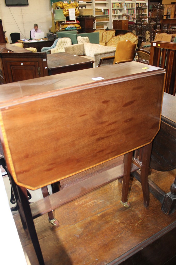 An Edwardian mahogany and crossbanded sutherland table, together with a walnut purdonium and a