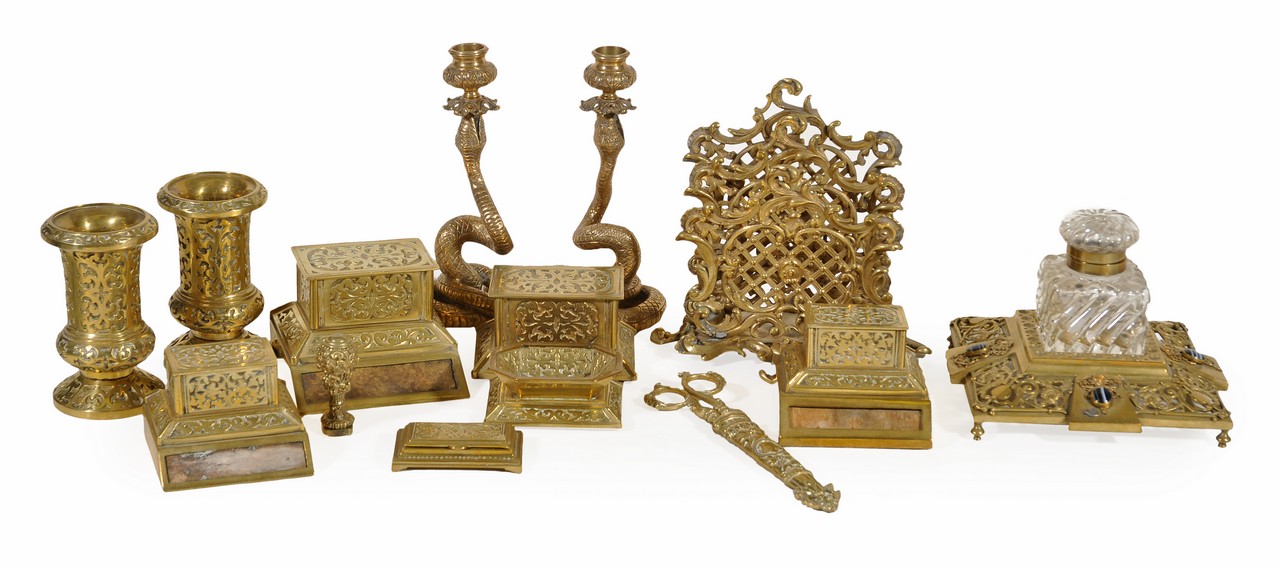 A Continental brass composite desk set, last quarter 19th century, comprising a cabochon mounted