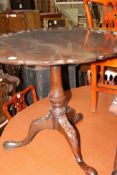 A George III mahogany tripod table,leg as found.