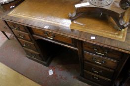 A late 19th Century mahogany kneehole desk with writing surface and nine drawers 120cm wide