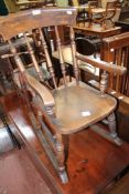 A childs rocking chair and an oak dropside table