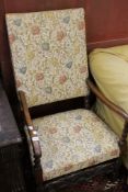 A 19th century walnut framed elbow chair in floral covers.