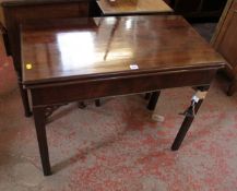 A George III mahogany tea table with pierced spandrels on channelled chamfered legs 91cm wide
