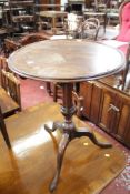 A 19th Century mahogany tilt top tripod table with a piecrust top