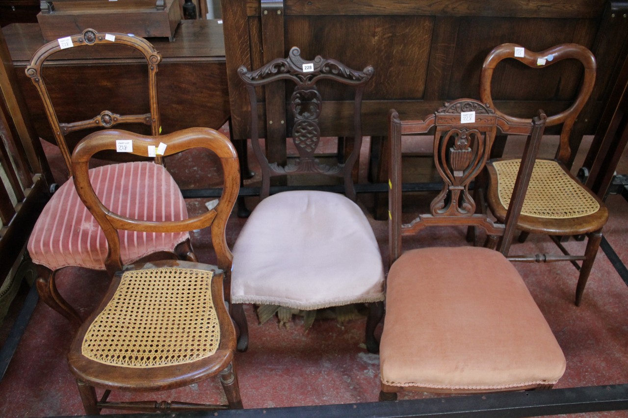 A pair of Victorian balloon back chairs and three further chairs