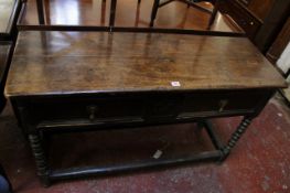 A Victorian two drawer oak sideboard on bobbin turned legs joined by stretchers 123cm wide