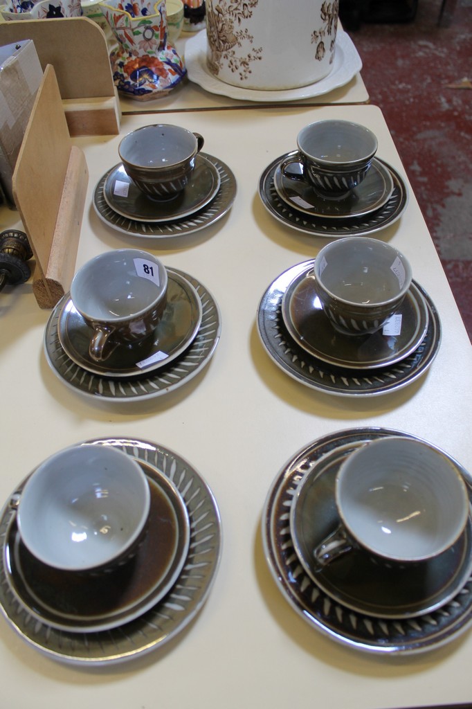 A Crowan pottery part tea set comprising six cups, saucers and side plates