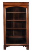 An Edwardian mahogany, satinwood, boxwood and ebony banded bowfront display cabinet, the glazed