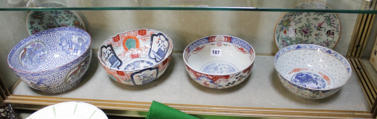 Four Oriental bowls and a pair of famille rose plates