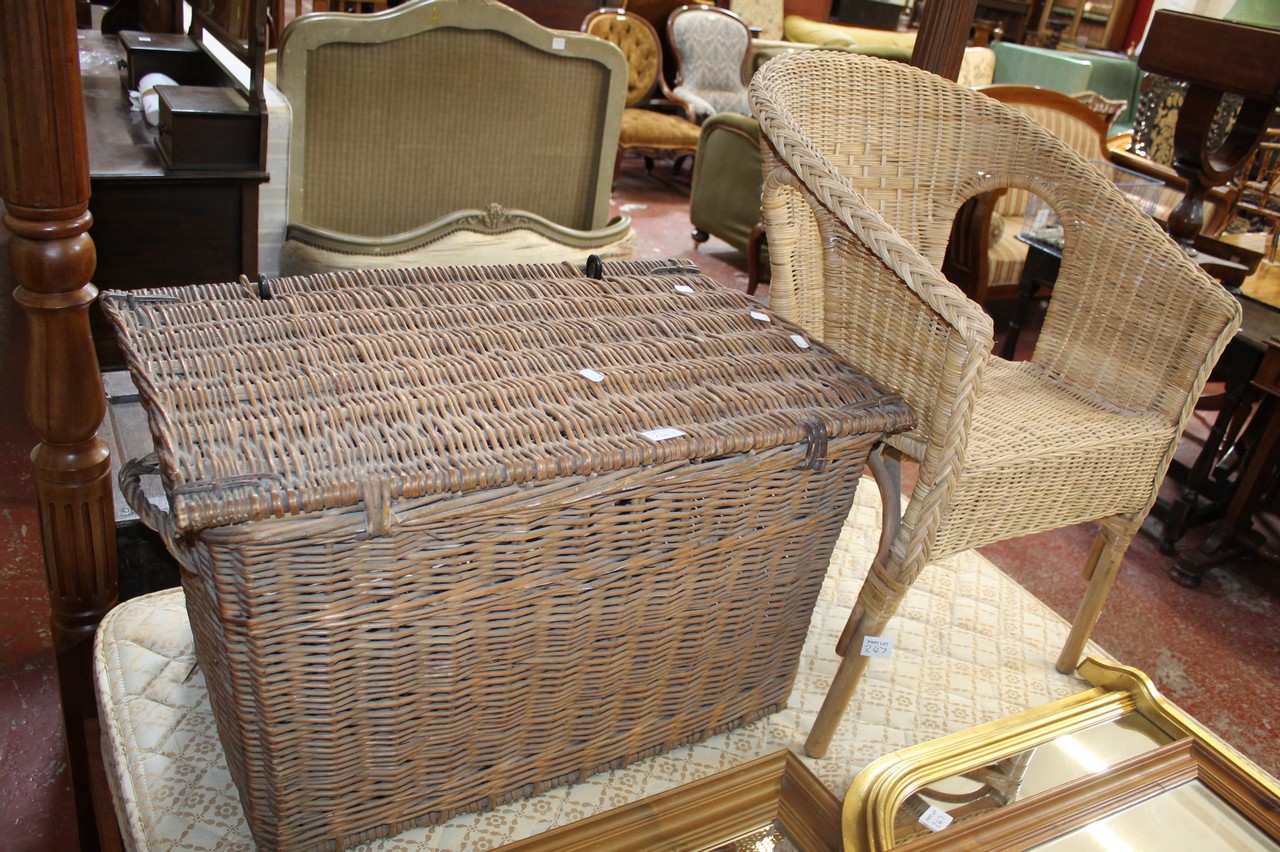 A cane laundry basket, cane chair and three mixed framed mirrors.