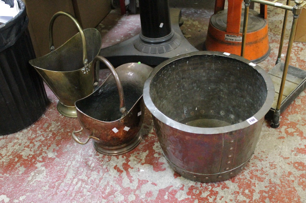 A Victorian brass stick stand, a copper log bin and two scuttles