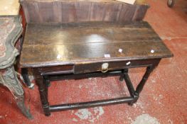 An oak side table, 18th century & later, rectangular top above a drawer on turned legs and
