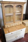 A pine glazed cabinet, pine bedside cupboard, a pine top side cabinet, matching coffee table and a