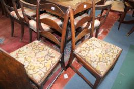 A pair of Georgian mahogany ladder back chairs.