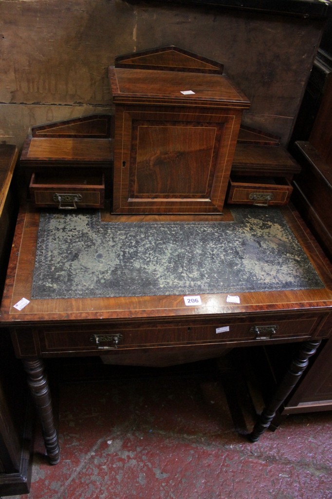 An Edwardian walnut and crossbanded writing table