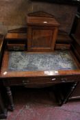 An Edwardian walnut and crossbanded writing table