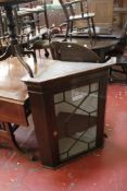 A Georgian mahogany glazed door hanging corner cupboard and a 19th century mahogany corner wash