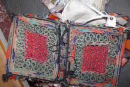 A quantity of three small woolwork rugs and other fabrics etc.