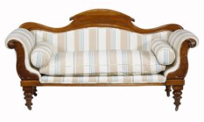 A Victorian walnut sofa, circa 1870, the yoke shaped back above a loose cushion seat, flanked by a