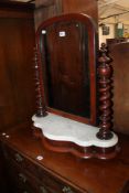 A Victorian dressing table mirror with marble plinth and barley twist supports.