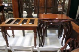 A nest of stained hardwood tables and a late Victorian suitcase rack  Best Bid
