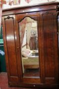 A Victorian mahogany mirror door wardrobe 206cm high, 155cm wide