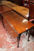 A George III mahogany dropleaf table with pad feet.