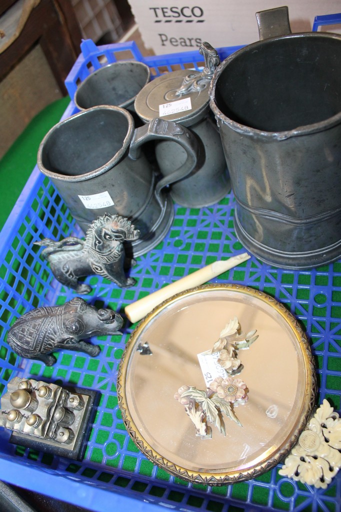 A Chinese hand mirror, a brass model of a Russian church, a pair of elephant bookends, a bamboo