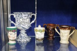 A 19th Century Staffordshire pottery Bacchus mug, together with three further vessels modelled with