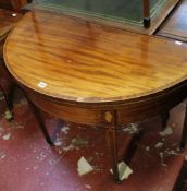 A 19th century mahogany and satinwood banded demi lune tea table 107cm wide
