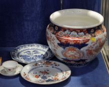 An Imari jardiniere, a Chinese blue and white vase, two Chinese plates, one cup and saucer (5) (