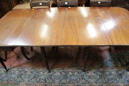 A George III mahogany dining table with two additional leaves 206cm extended