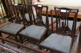 A set of six early 19th Century mahogany dining chairs with pierced splat and drop in seat