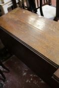 A 19th Century oak drop leaf table  Best Bid