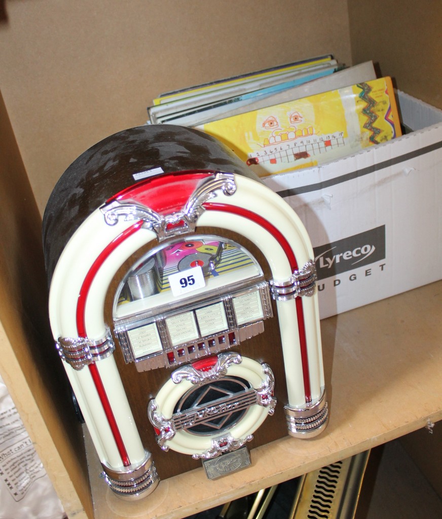 A collectors edition Rock `n Roll Radio (sold as parts) together with a small quantity of LPs