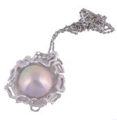 A cultured blister pearl pendant , the circular cultured blister pearl...  A cultured blister