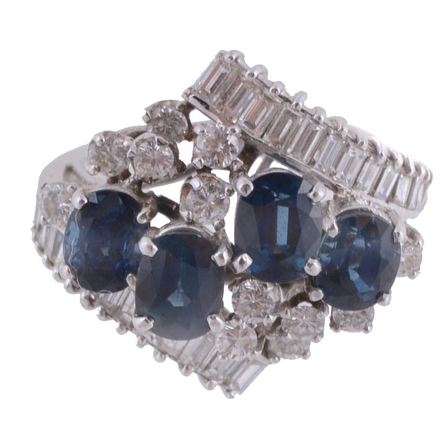 A sapphire and diamond ring, the four oval shaped sapphires within a...  A sapphire and diamond
