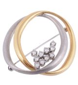 A diamond two colour brooch, composed of two oval links  A diamond two colour brooch,   composed